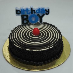 Chocolate cake with birthday boy candle 